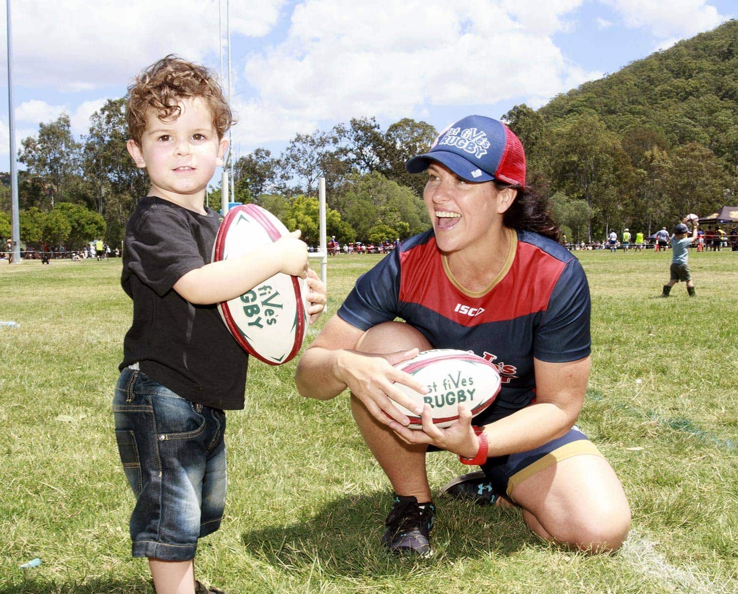 Child Smiling Playing Rugby